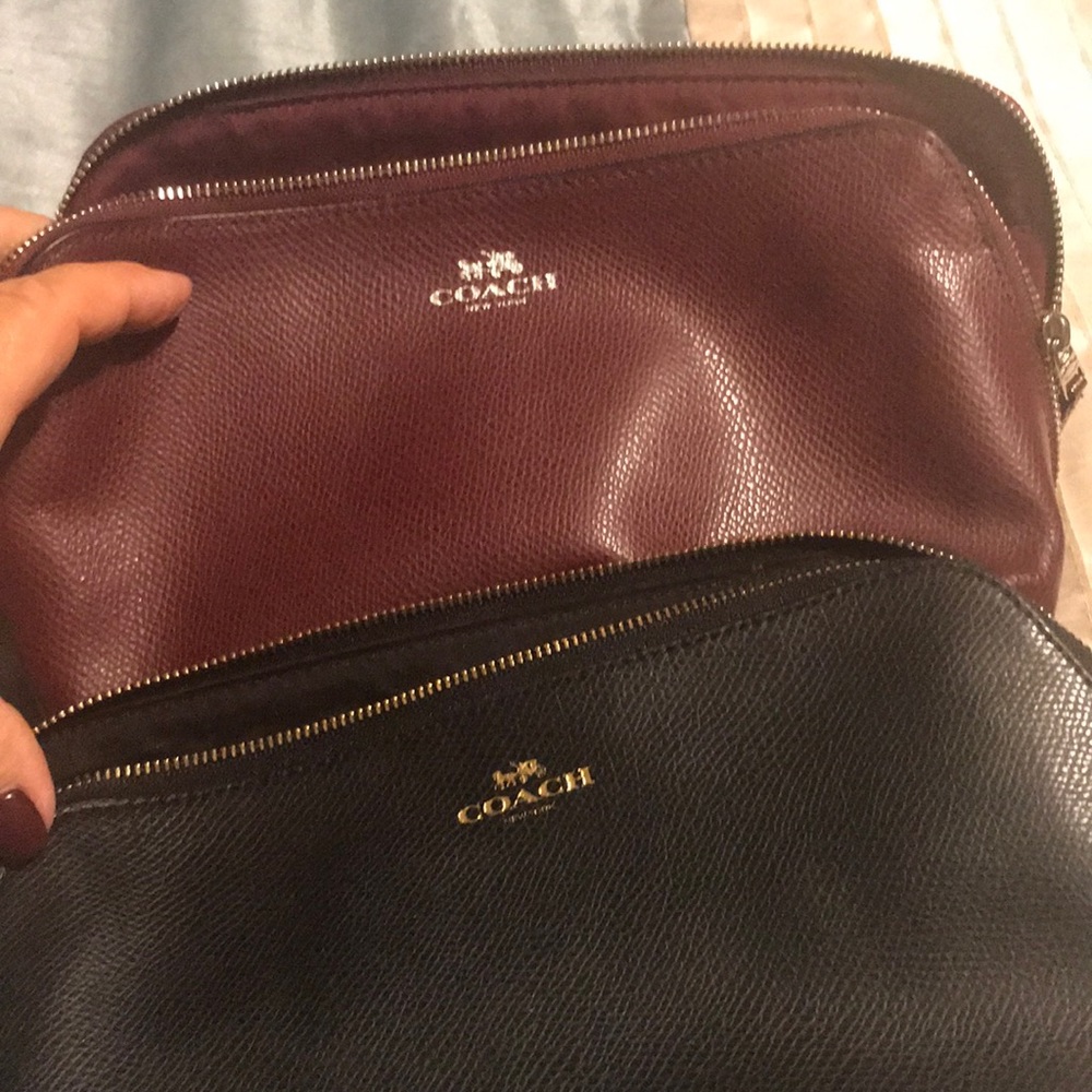 2 Coach makeup bag or clutch